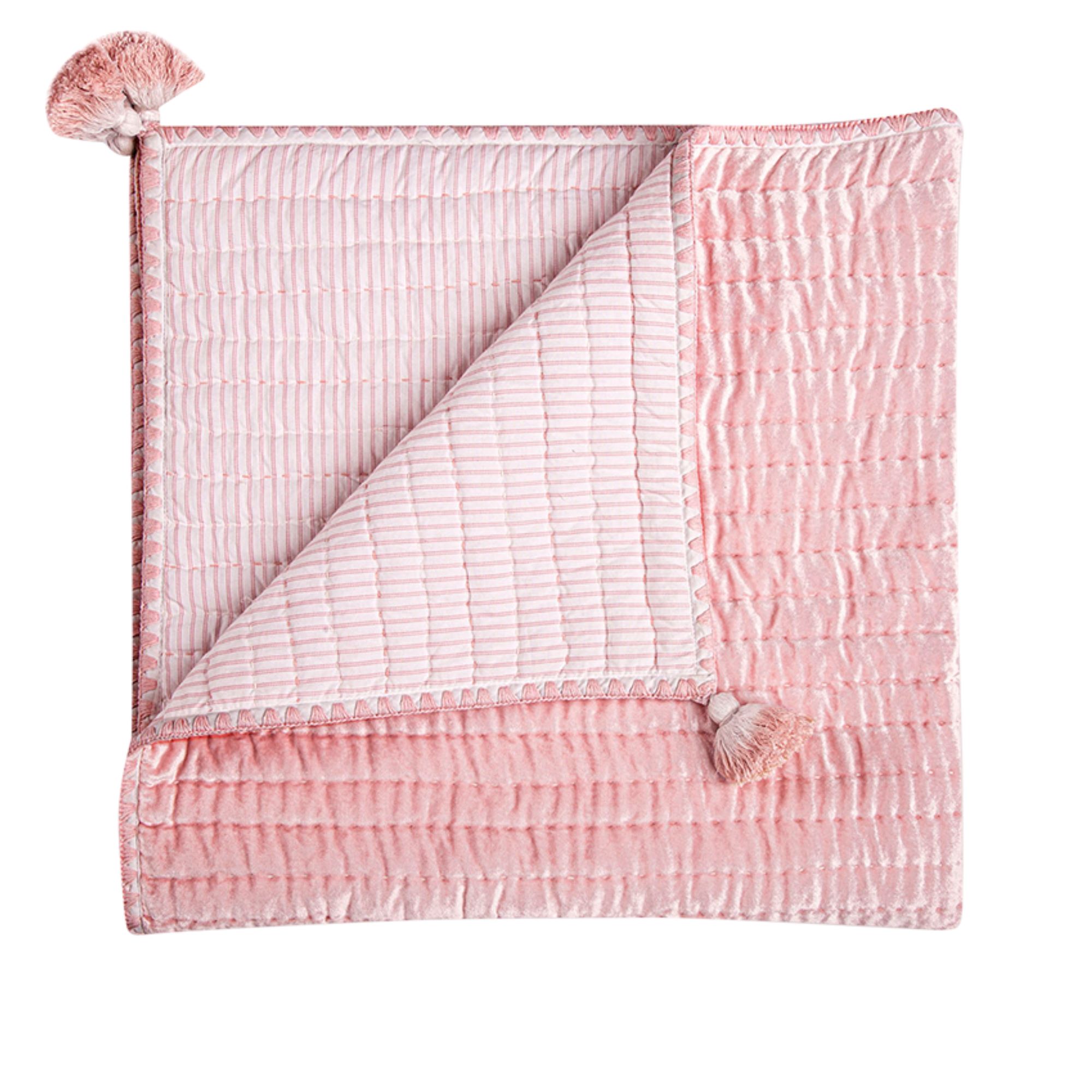 Pink quilted blanket on white background