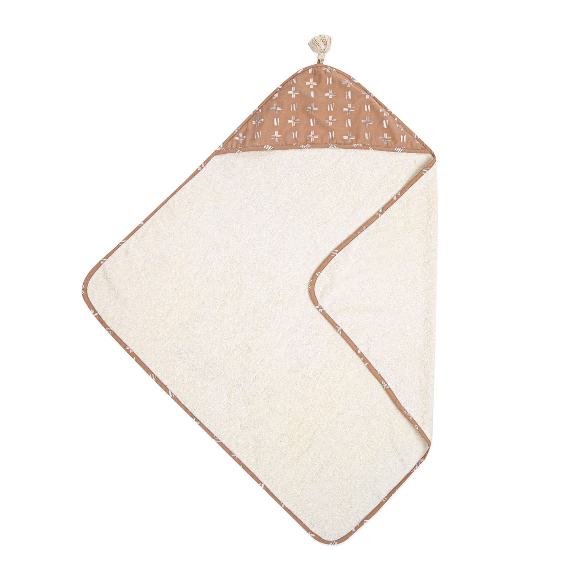 A brown and white hooded towel for a baby