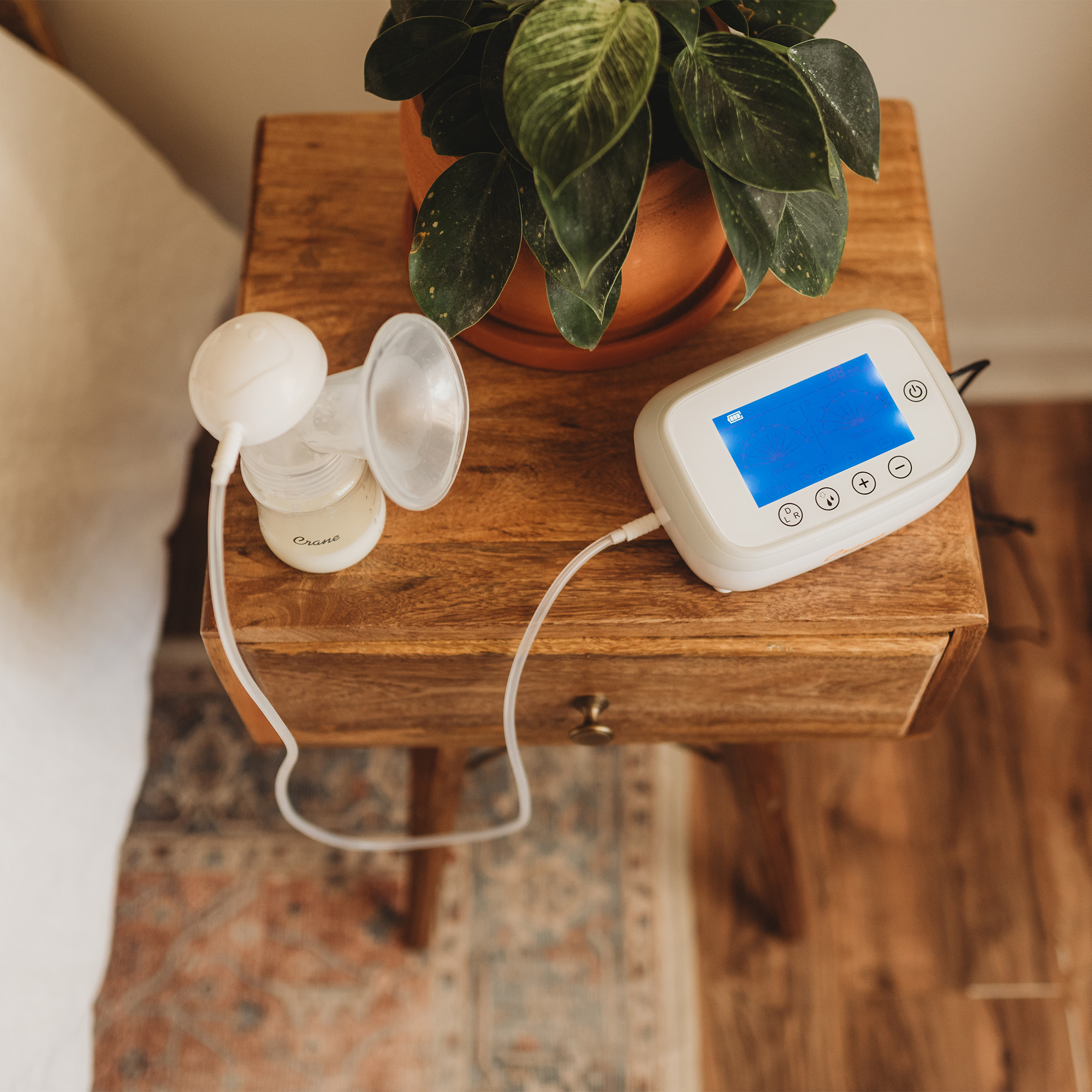 Breast pump plugged in on table