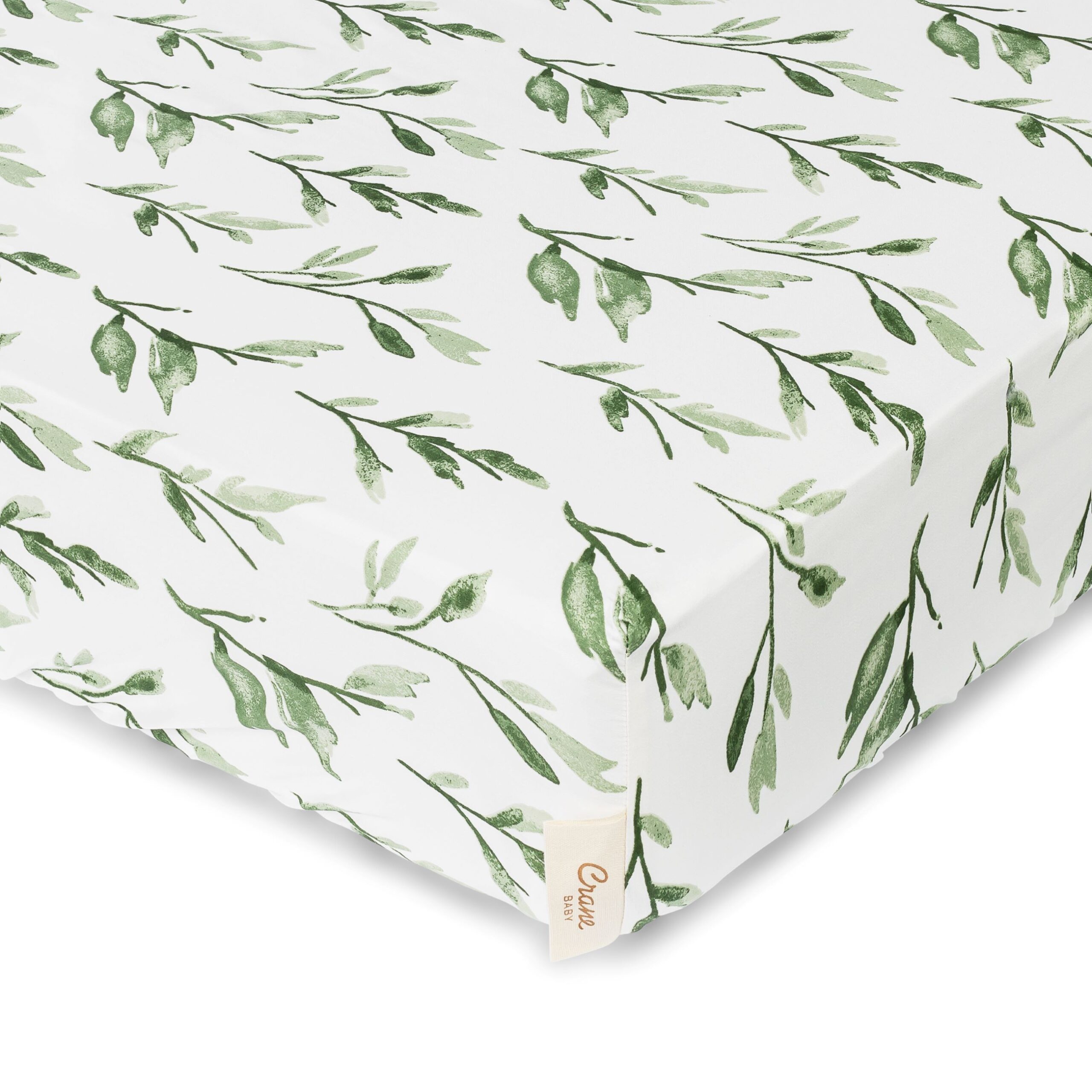 Crib sheet with leaf design on white background
