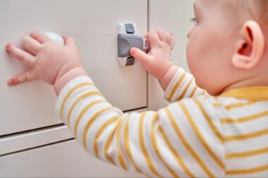 Baby playing with a child lock
