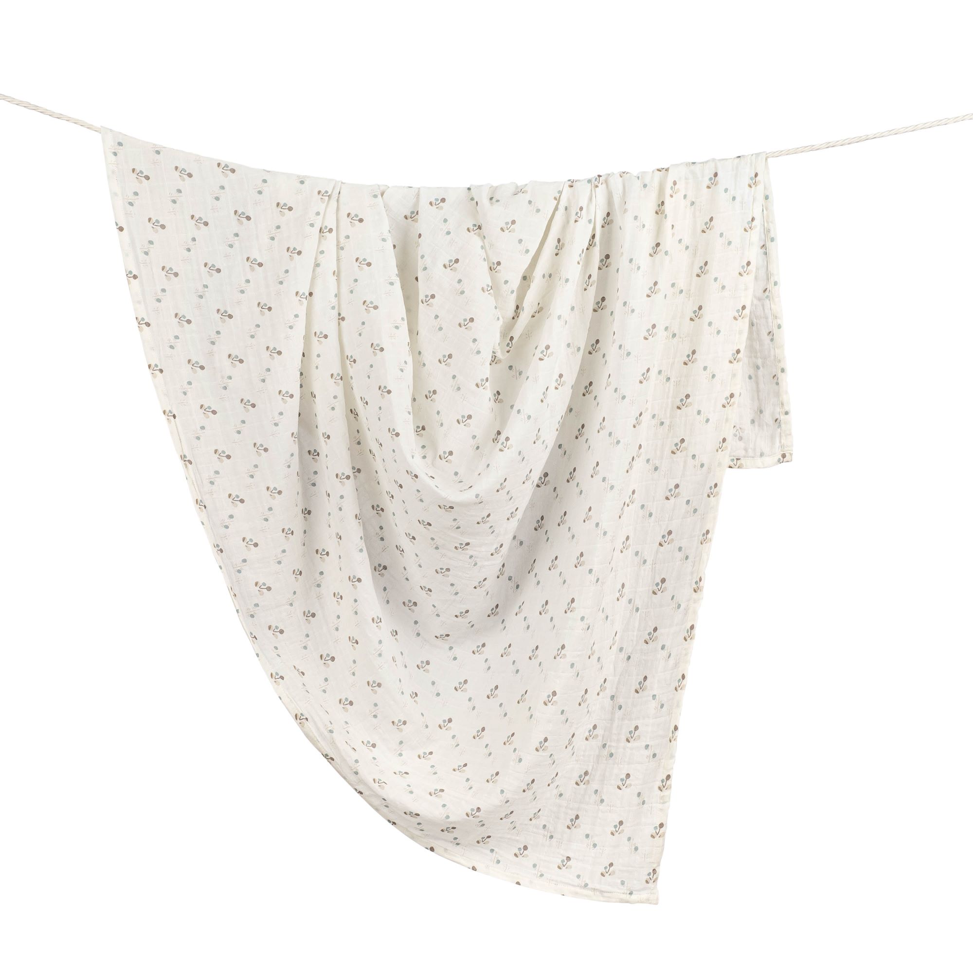 Baby swaddle hanging on clothesline