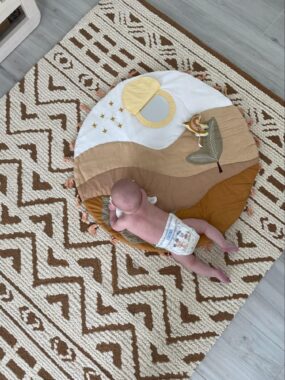 Baby doing tummy time on a play mat