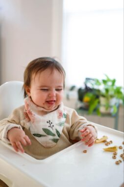 Baby eating in a high chair