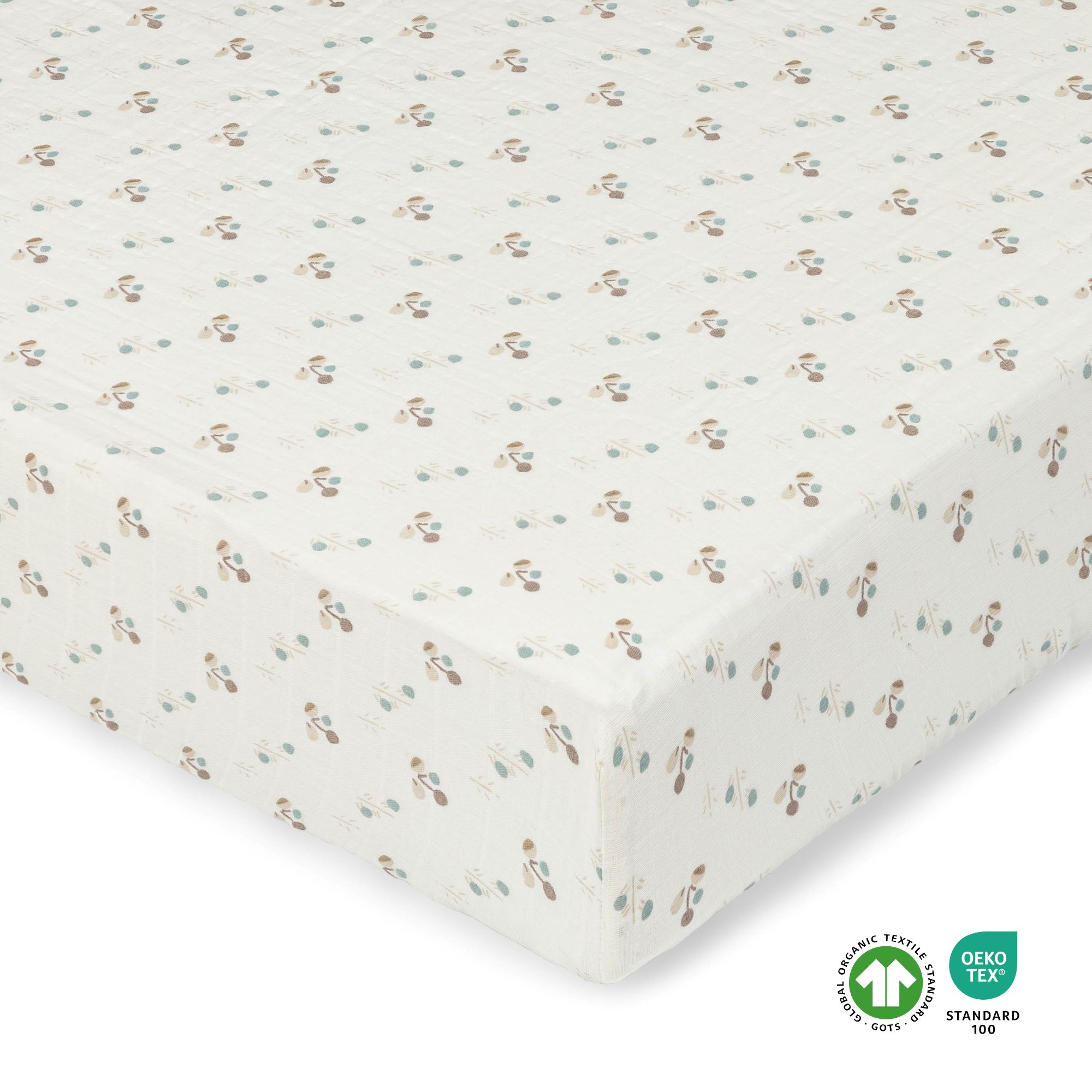 A cream colored crib sheet with poppy designs