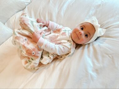 Baby wearing a wearable blanket