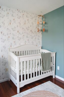 Baby crib in the corner of a nursery