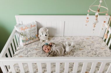 Baby lying down in a crib