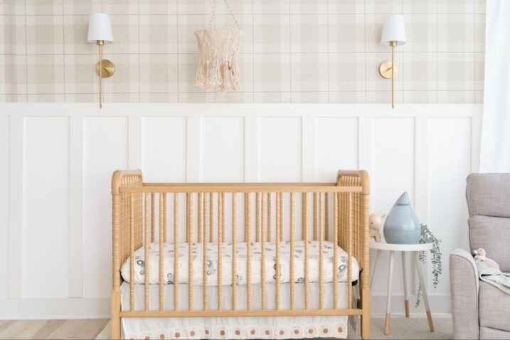 Baby crib with a tractor crib sheet